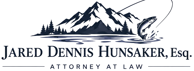 Jared Dennis Hunsaker, Esq., Attorney at Law logo: mountain peaks above a lake with a leaping trout